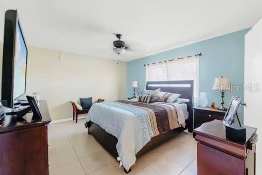 6656 Pinecrest Ln N, Pinellas Park, FL 33781 - bedroom with light tile patterned floors