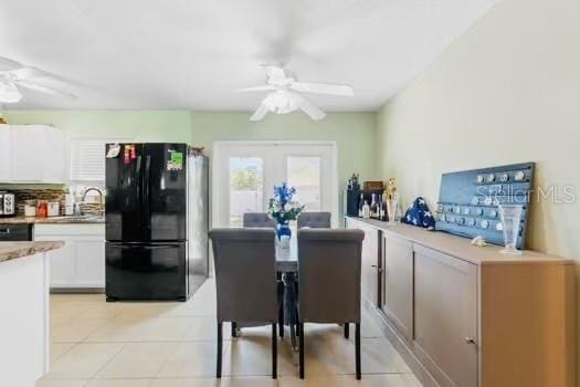 6656 Pinecrest Ln N, Pinellas Park, FL 33781 - dining area featuring ceiling fan and light tile patterned floors
