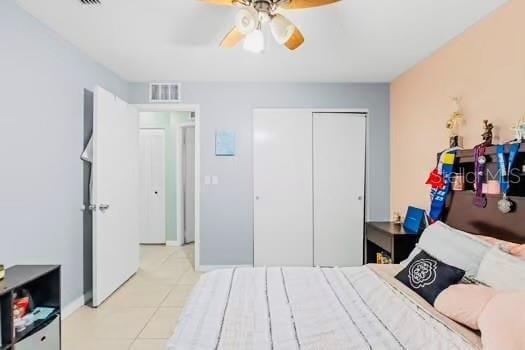 6656 Pinecrest Ln N, Pinellas Park, FL 33781 - bedroom featuring tile patterned flooring, a closet, a ceiling fan, and baseboards