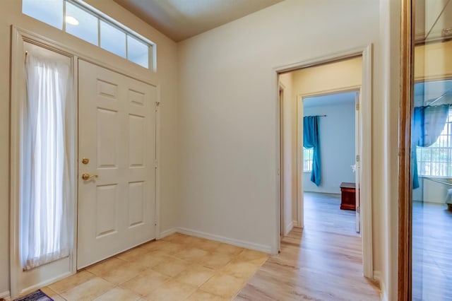 14466 Tamarind Loop, Spring Hill, FL 34609 - entryway with light wood finished floors and baseboards
