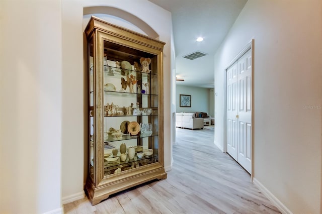 14466 Tamarind Loop, Spring Hill, FL 34609 - corridor featuring light wood-type flooring and baseboards