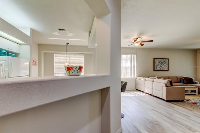 14466 Tamarind Loop, Spring Hill, FL 34609 - living area with wood finished floors and a ceiling fan