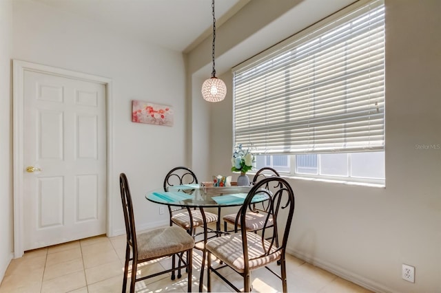 14466 Tamarind Loop, Spring Hill, FL 34609 - dining room featuring light tile patterned floors and baseboards