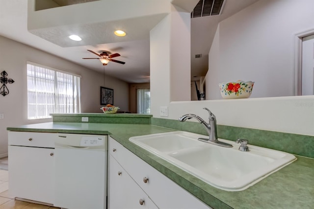 14466 Tamarind Loop, Spring Hill, FL 34609 - kitchen featuring dishwasher, a sink, a peninsula, white cabinets, and ceiling fan