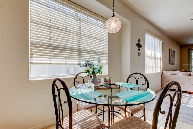14466 Tamarind Loop, Spring Hill, FL 34609 - tiled dining room featuring a chandelier