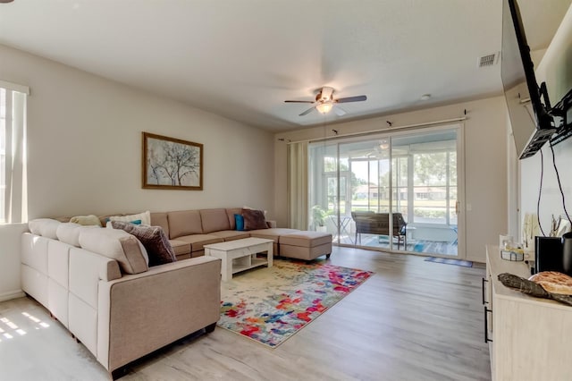 14466 Tamarind Loop, Spring Hill, FL 34609 - living room featuring ceiling fan and light wood-type flooring