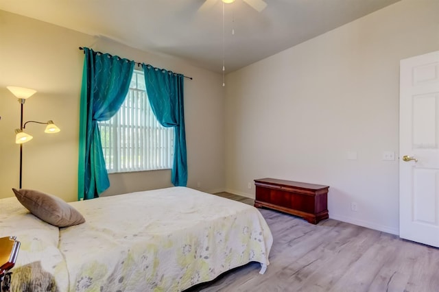 14466 Tamarind Loop, Spring Hill, FL 34609 - bedroom featuring wood finished floors, baseboards, and ceiling fan