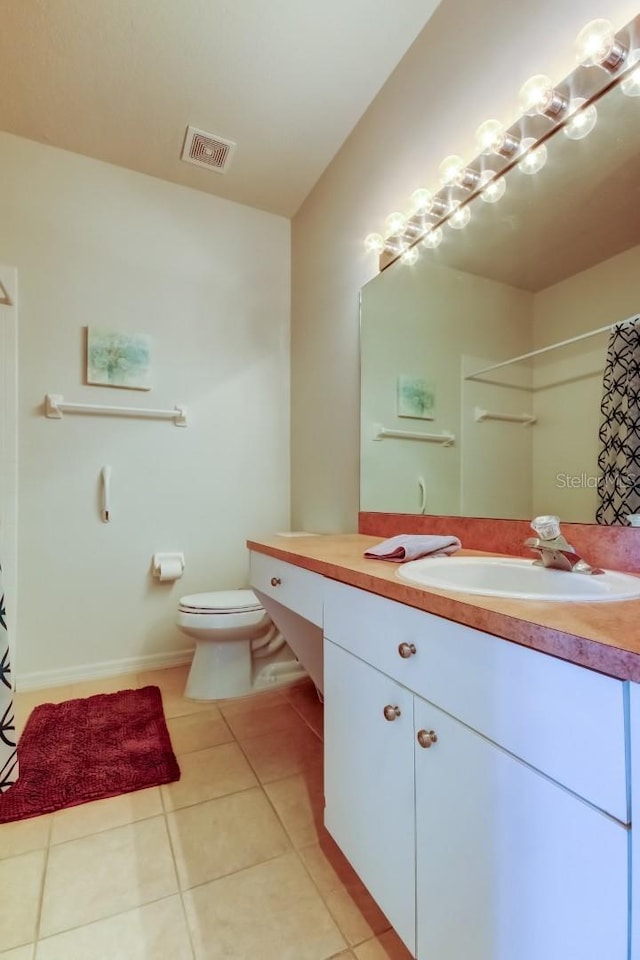 14466 Tamarind Loop, Spring Hill, FL 34609 - bathroom featuring tile patterned flooring, vanity, toilet, and curtained shower