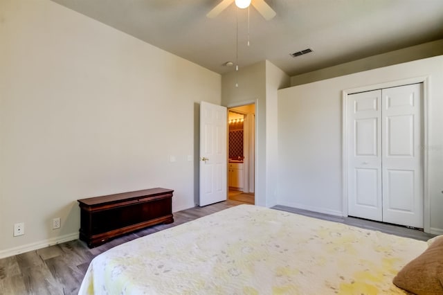 14466 Tamarind Loop, Spring Hill, FL 34609 - bedroom featuring wood finished floors, baseboards, ceiling fan, and a closet