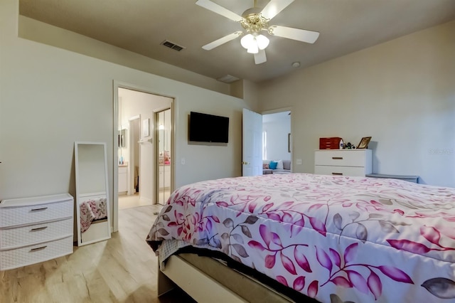 14466 Tamarind Loop, Spring Hill, FL 34609 - bedroom with light wood-style flooring and ceiling fan