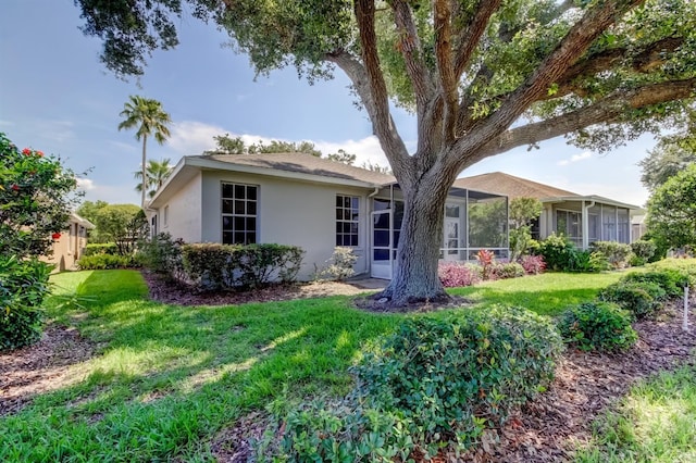 14466 Tamarind Loop, Spring Hill, FL 34609 - ranch-style house with stucco siding and a front lawn