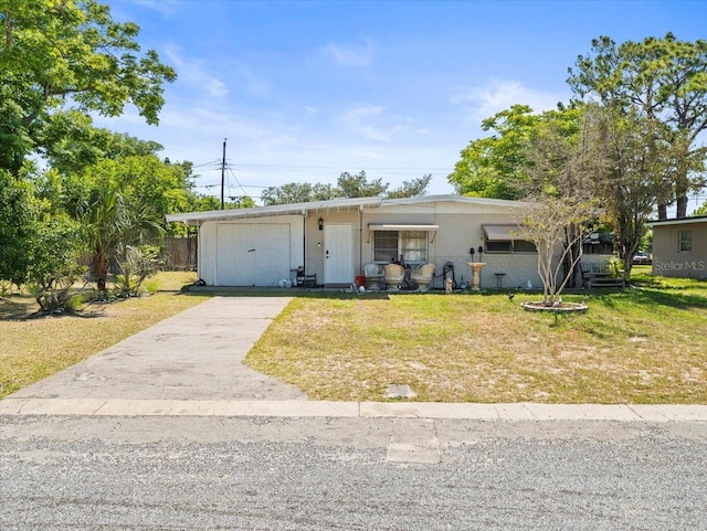 5045 Grand Blvd, New Port Richey, FL 34652 - view of front facade featuring a front lawn and driveway