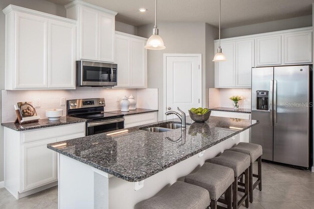 1681 W Palms Dr, Port Charlotte, FL 33953 - kitchen with stainless steel appliances, a sink, decorative backsplash, white cabinetry, and recessed lighting