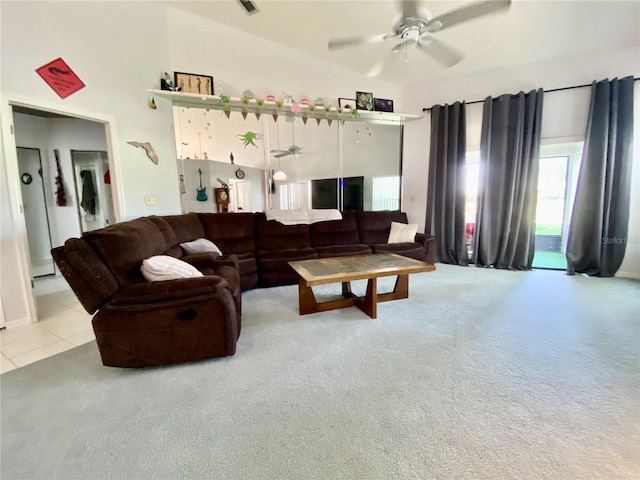 9200 Turnberry Ct, New Port Richey, FL 34655 - carpeted living room with ceiling fan, vaulted ceiling, and tile patterned floors
