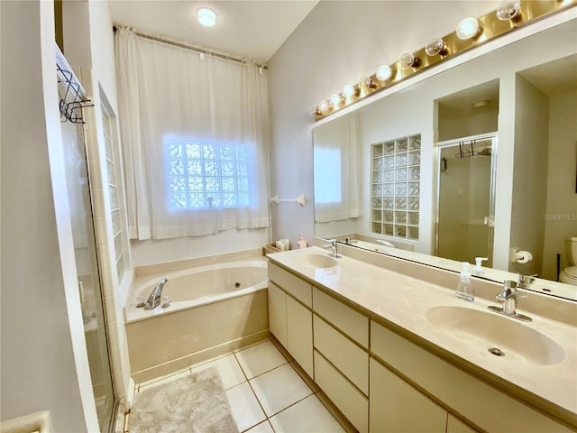 9200 Turnberry Ct, New Port Richey, FL 34655 - bathroom with a garden tub, a stall shower, double vanity, toilet, and tile patterned flooring