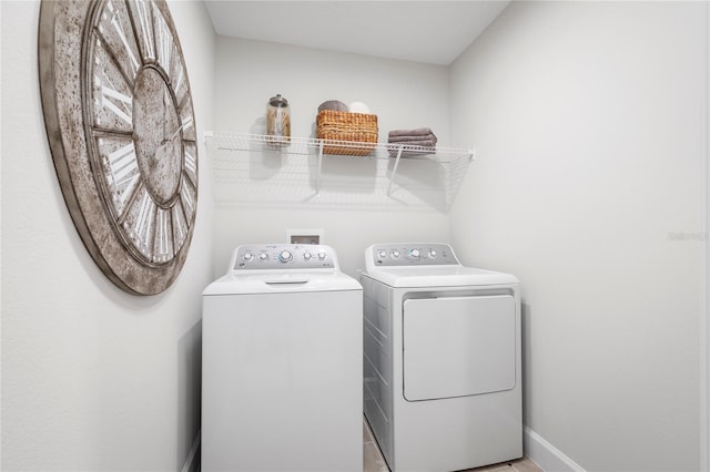 1705 W Palms Dr, Port Charlotte, FL 33953 - washroom featuring washing machine and dryer and baseboards