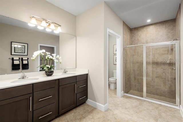 1723 W Palms Dr, Port Charlotte, FL 33953 - full bath featuring double vanity, a shower stall, toilet, tile patterned flooring, and baseboards