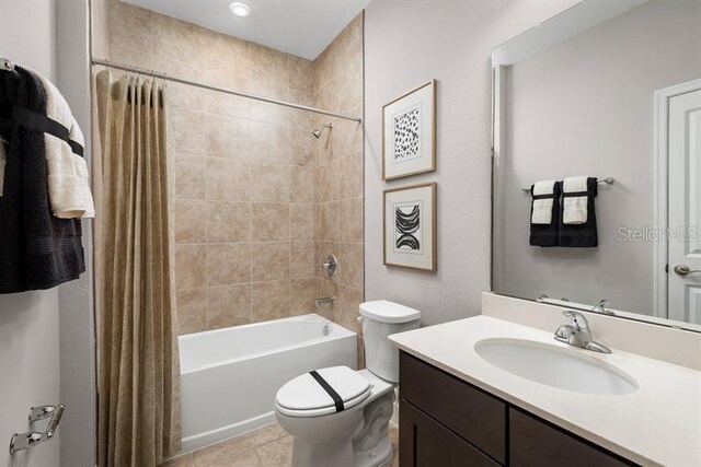 1723 W Palms Dr, Port Charlotte, FL 33953 - bathroom featuring shower / bath combo, vanity, toilet, and tile patterned flooring