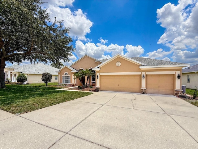 13248 Linzia Ln, Spring Hill, FL 34609 - view of front of property with stucco siding, a garage, concrete driveway, and a front yard
