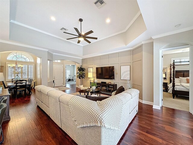 13248 Linzia Ln, Spring Hill, FL 34609 - living room featuring arched walkways, a ceiling fan, hardwood / wood-style flooring, ornamental molding, and baseboards