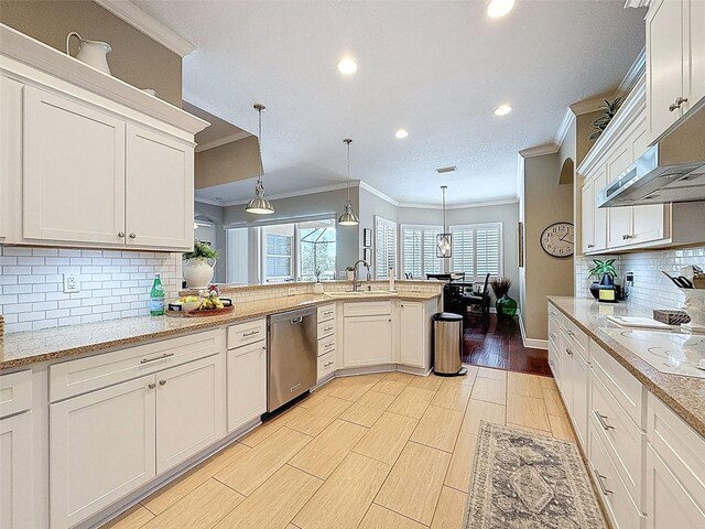 13248 Linzia Ln, Spring Hill, FL 34609 - kitchen with stainless steel dishwasher, a sink, crown molding, white electric cooktop, and decorative backsplash
