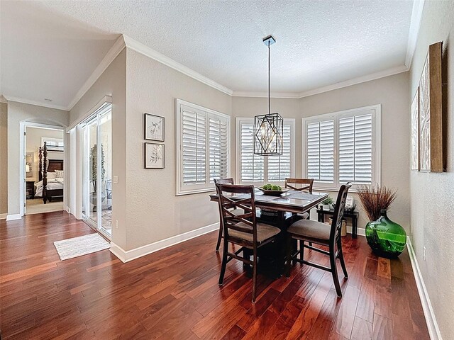 13248 Linzia Ln, Spring Hill, FL 34609 - dining room featuring a textured wall, dark wood-style floors, ornamental molding, baseboards, and a textured ceiling