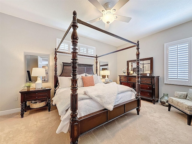 13248 Linzia Ln, Spring Hill, FL 34609 - bedroom featuring light colored carpet, baseboards, and a ceiling fan