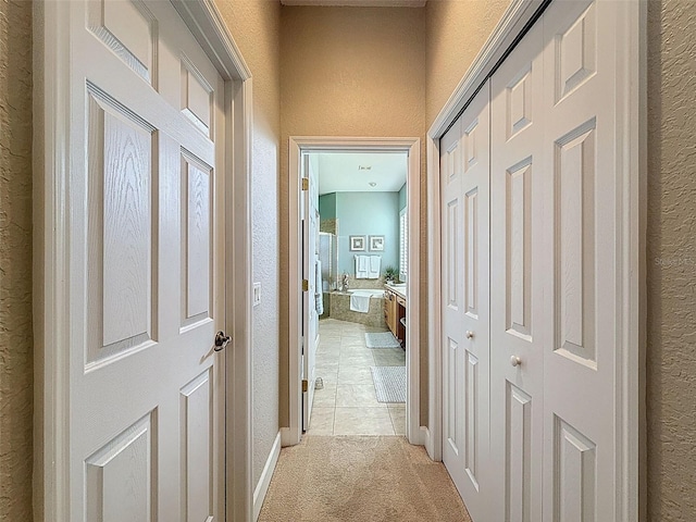 13248 Linzia Ln, Spring Hill, FL 34609 - hallway featuring a textured wall and light carpet