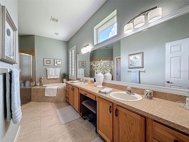 13248 Linzia Ln, Spring Hill, FL 34609 - bathroom featuring a shower stall, double vanity, tile patterned flooring, a bath, and a textured ceiling
