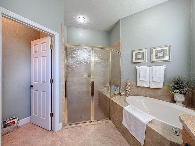 13248 Linzia Ln, Spring Hill, FL 34609 - bathroom with a garden tub, a shower stall, tile patterned floors, and a textured ceiling