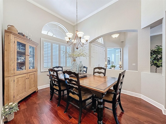 13248 Linzia Ln, Spring Hill, FL 34609 - dining area featuring arched walkways, ornamental molding, baseboards, and dark wood finished floors
