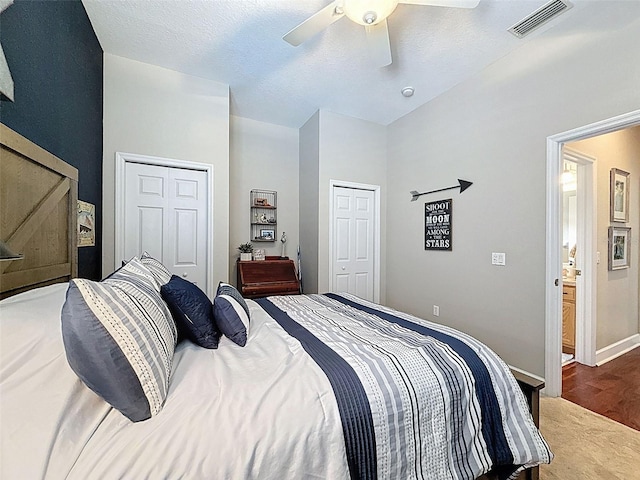 13248 Linzia Ln, Spring Hill, FL 34609 - bedroom featuring two closets, wood finished floors, ceiling fan, and baseboards