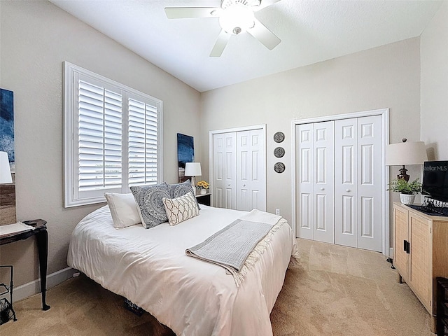 13248 Linzia Ln, Spring Hill, FL 34609 - bedroom with light carpet, multiple closets, ceiling fan, and baseboards