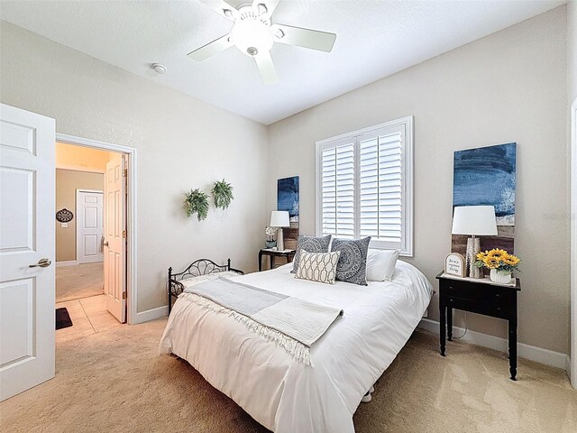 13248 Linzia Ln, Spring Hill, FL 34609 - bedroom featuring light carpet, baseboards, and ceiling fan