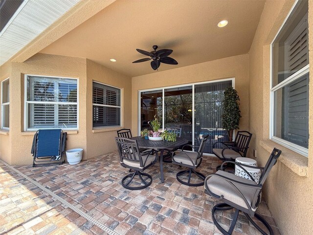 13248 Linzia Ln, Spring Hill, FL 34609 - view of patio with ceiling fan and outdoor dining area