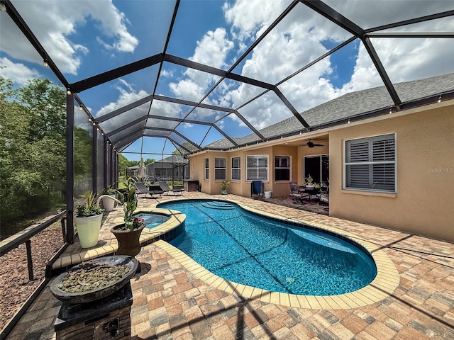 13248 Linzia Ln, Spring Hill, FL 34609 - view of pool featuring a patio, a ceiling fan, a pool with connected hot tub, and glass enclosure