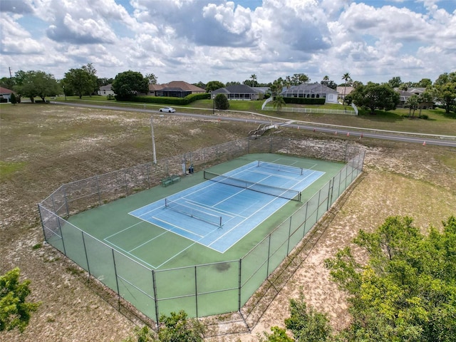 13248 Linzia Ln, Spring Hill, FL 34609 - view of tennis court featuring a residential view