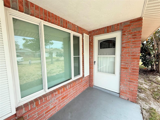 11034 Harding Dr, Port Richey, FL 34668 - doorway to property featuring brick siding