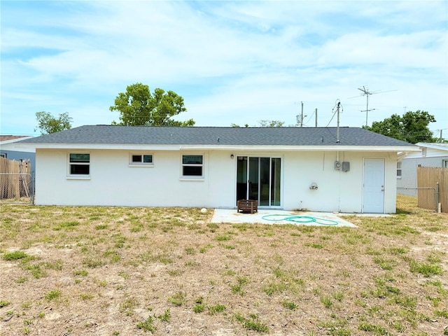 11034 Harding Dr, Port Richey, FL 34668 - back of house featuring stucco siding