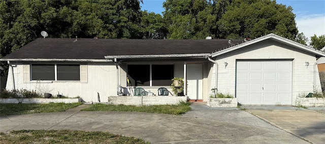 11726 Oceanside Dr, Port Richey, FL 34668 - ranch-style house featuring concrete driveway, covered porch, and brick siding