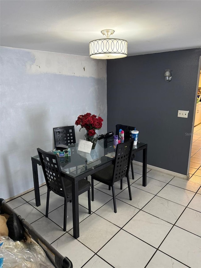 11726 Oceanside Dr, Port Richey, FL 34668 - dining space with light tile patterned flooring