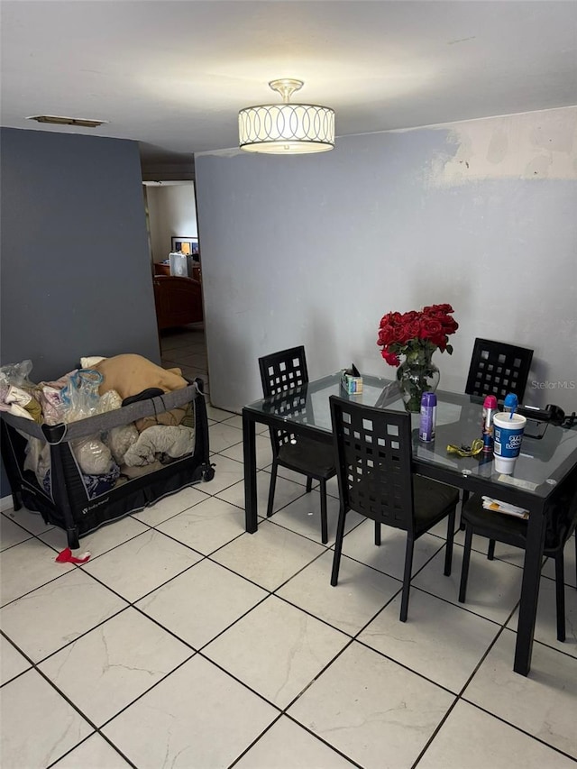 11726 Oceanside Dr, Port Richey, FL 34668 - dining space with light tile patterned floors