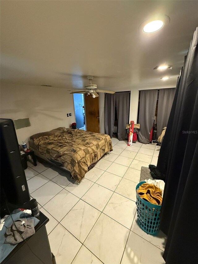 11726 Oceanside Dr, Port Richey, FL 34668 - bedroom featuring light tile patterned flooring