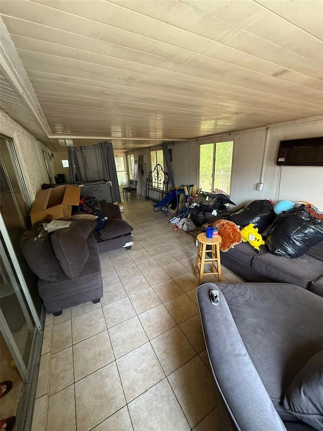 11726 Oceanside Dr, Port Richey, FL 34668 - living area featuring light tile patterned floors, a wall mounted air conditioner, and wooden ceiling