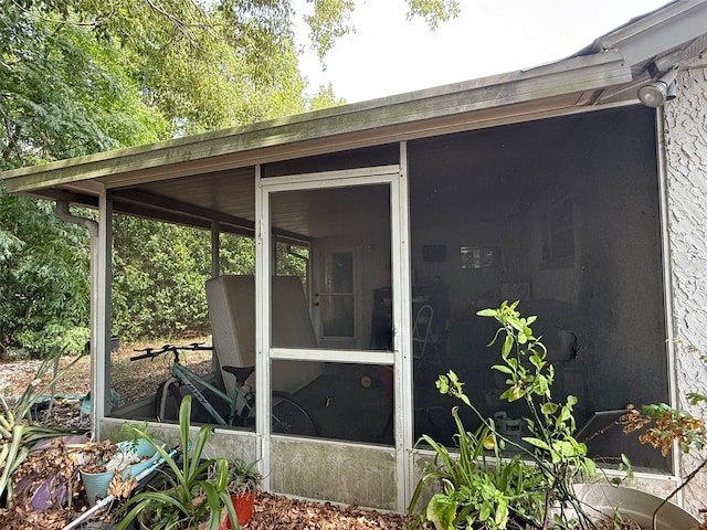 11726 Oceanside Dr, Port Richey, FL 34668 - view of side of home featuring a sunroom