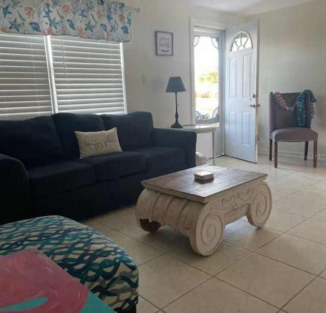 6603 Adams St, New Port Richey, FL 34652 - living room featuring light tile patterned floors and baseboards