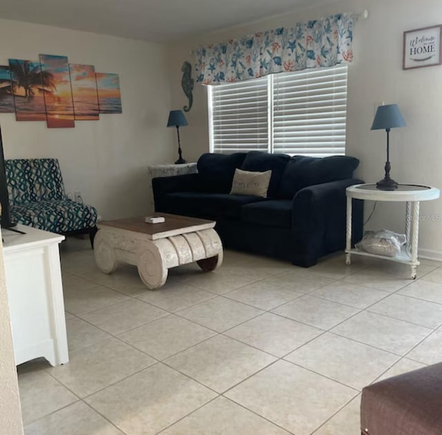 6603 Adams St, New Port Richey, FL 34652 - living area featuring light tile patterned floors and baseboards