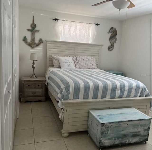 6603 Adams St, New Port Richey, FL 34652 - bedroom featuring light tile patterned flooring and ceiling fan