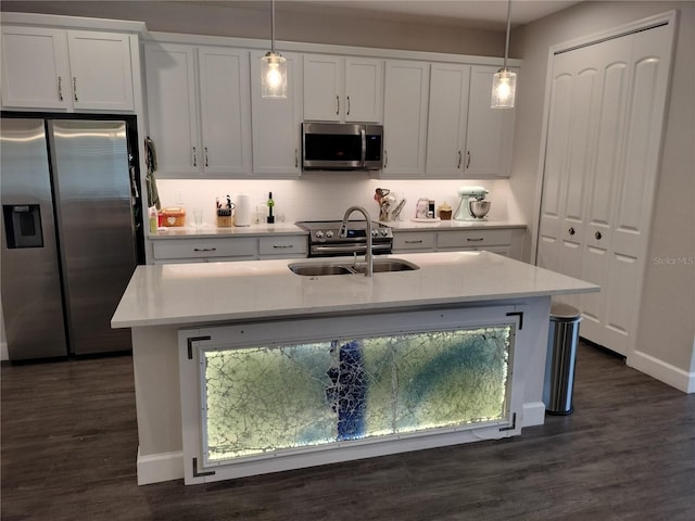 9967 Patrician Dr, New Port Richey, FL 34655 - kitchen featuring stainless steel appliances, a sink, light countertops, and pendant lighting