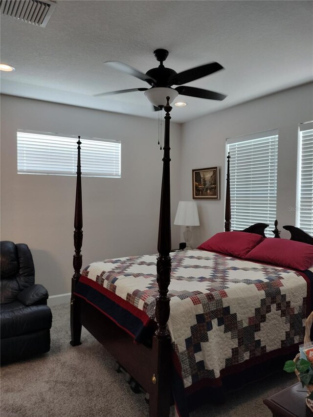 9967 Patrician Dr, New Port Richey, FL 34655 - carpeted bedroom featuring a ceiling fan and baseboards
